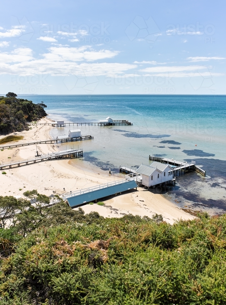 Private jetties & boat sheds from coastal walkways - Australian Stock Image