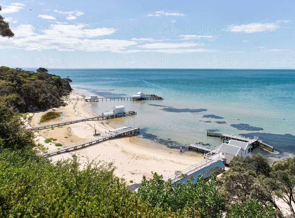 Image of Private jettys & boatsheds from coastal walkway - Austockphoto