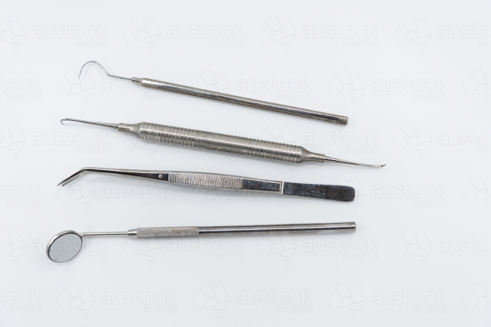 Image of Professional dental instruments on white background - Austockphoto