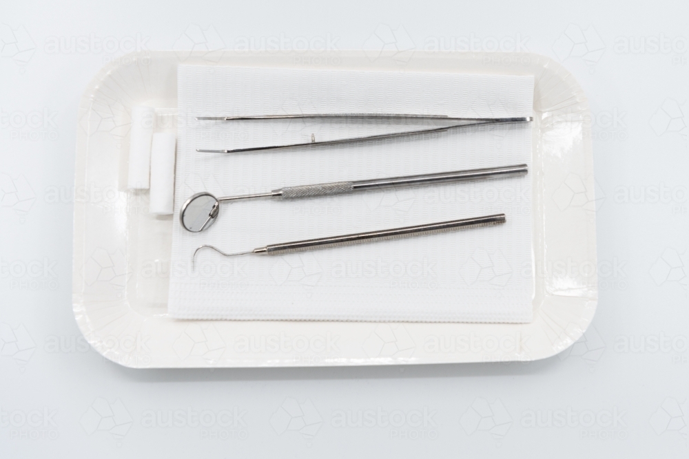 Professional dental instruments on white background - Australian Stock Image