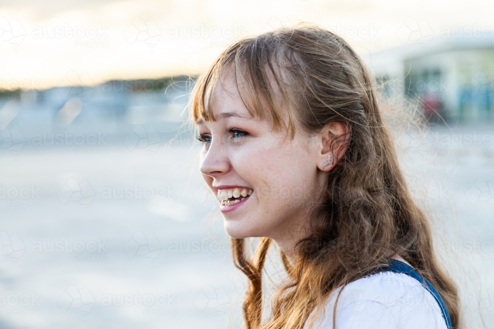 Profile of happy young woman with copy space - Australian Stock Image