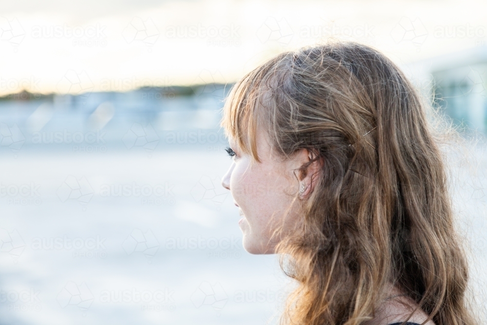 Profile of happy young woman with copy space - Australian Stock Image
