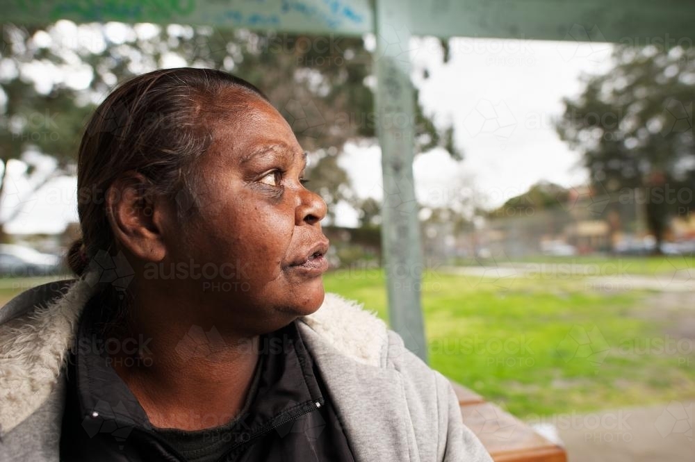 Profile of Indigenous Australian woman Outdoors - Australian Stock Image