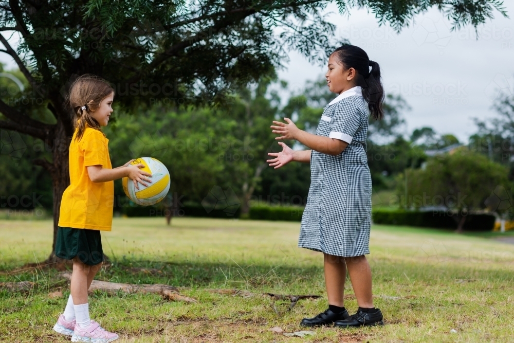 Public school girls playing a ball game outside - Australian Stock Image