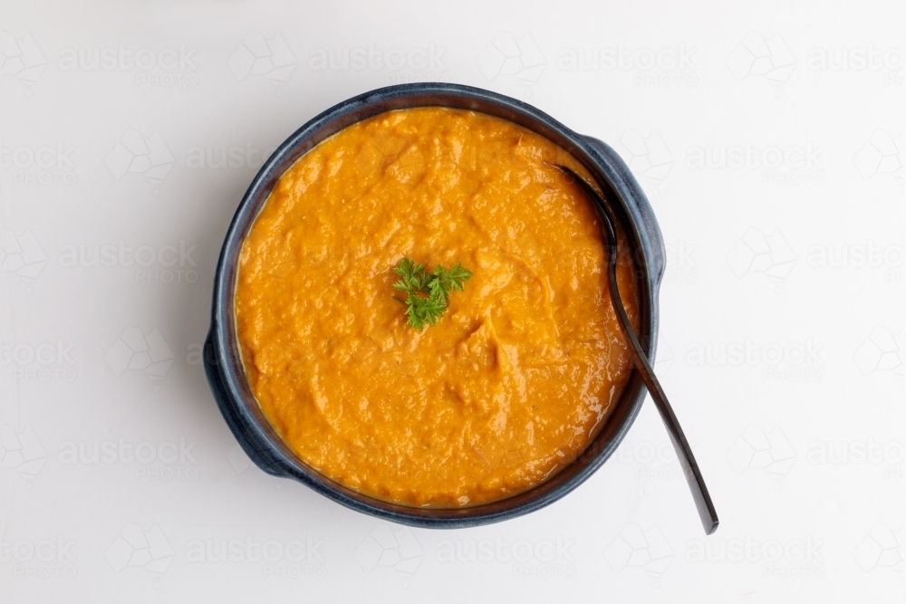 Pumpkin soup topped with parsley - Australian Stock Image