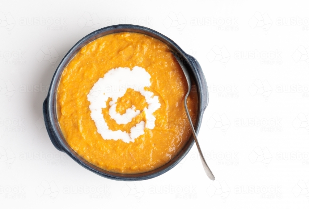Pumpkin soup with sour cream - Australian Stock Image