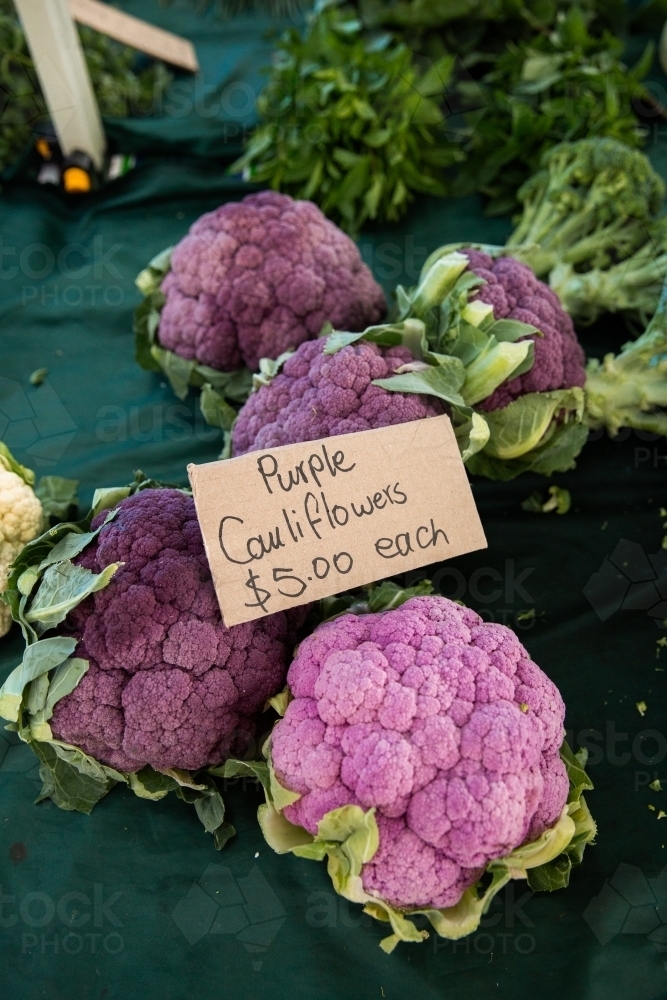 purple cauliflowers on a table for sale - Australian Stock Image