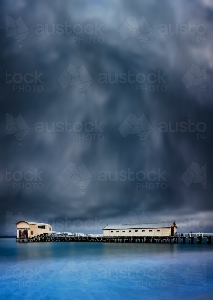 Queenscliff Pier with dramatic grey clouds overhead - Australian Stock Image