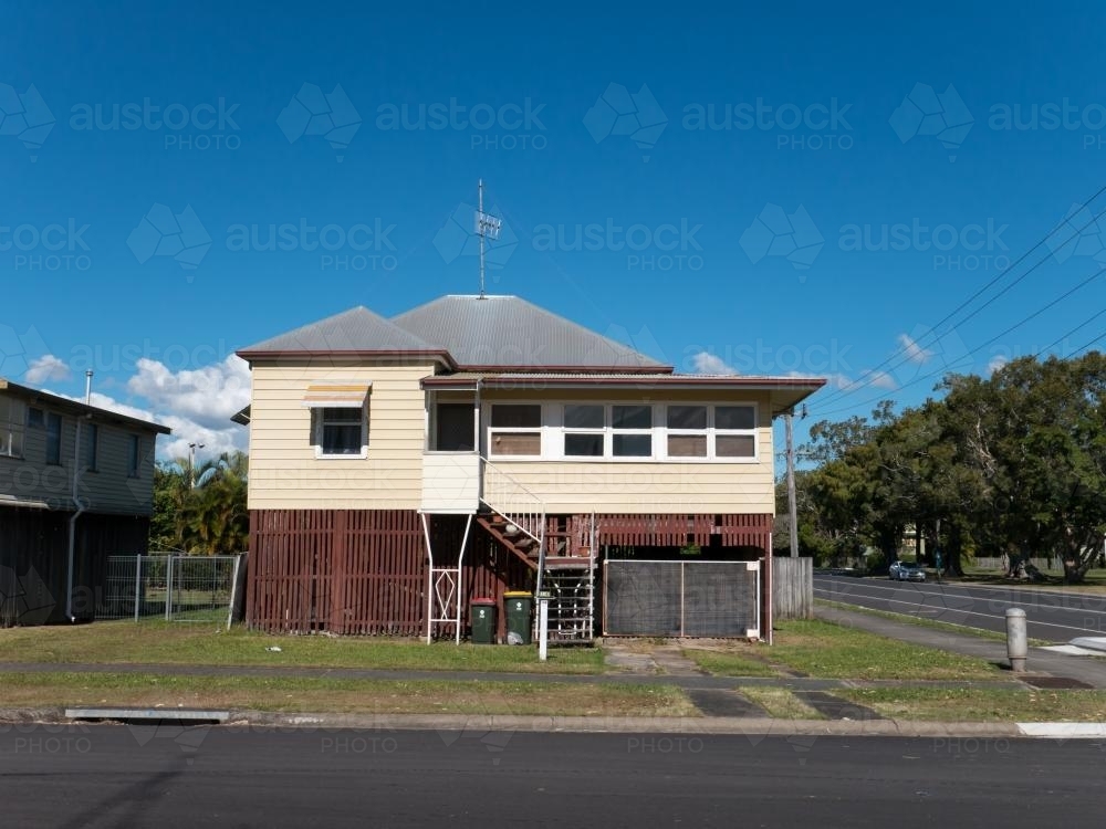 Queenslander style house in town elevated off the ground - Australian Stock Image