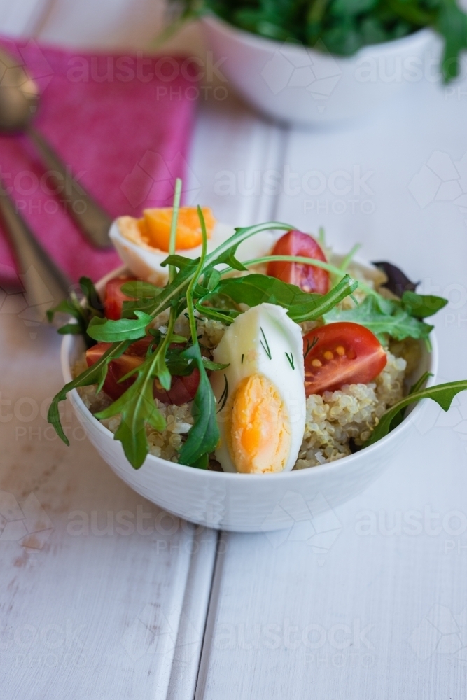 quinoa salad with chicken, egg, rocket and mustard - Australian Stock Image