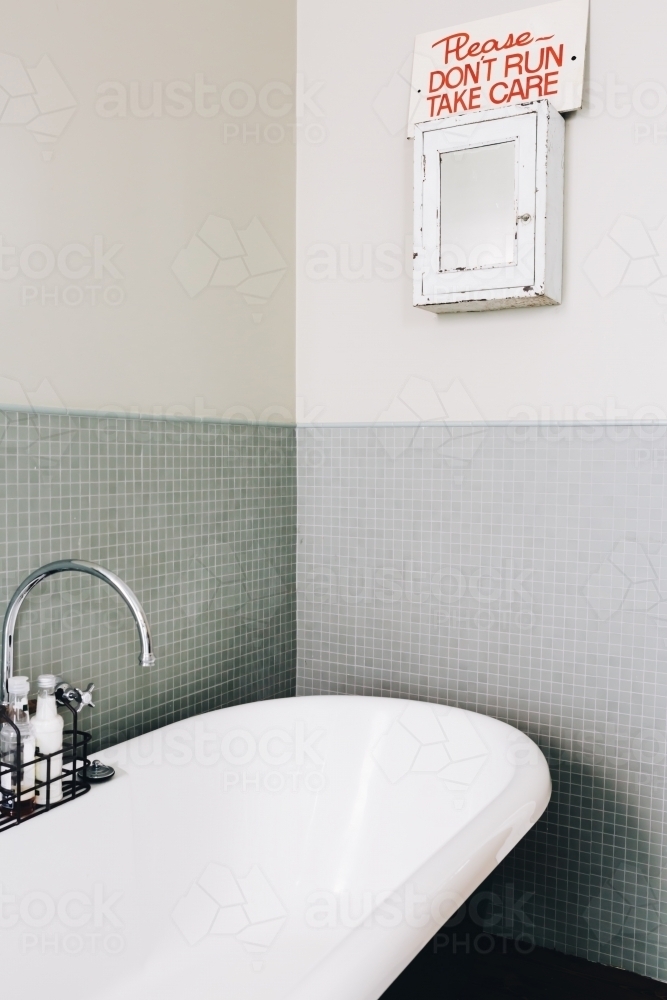 Quirky 'Don't Run' sign in a gorgeous vintage styled bathroom - Australian Stock Image