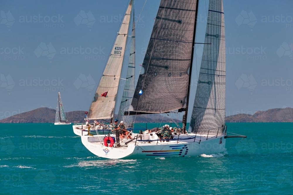 Racing yacht on turquoise water at Hamilton Island Race Week - Australian Stock Image
