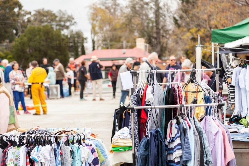 Image of Racks of clothes at car boot sale market - Austockphoto
