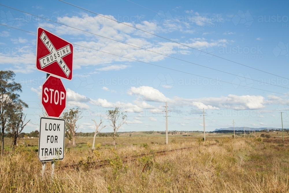 Railway crossing stop look for trains sign - Australian Stock Image
