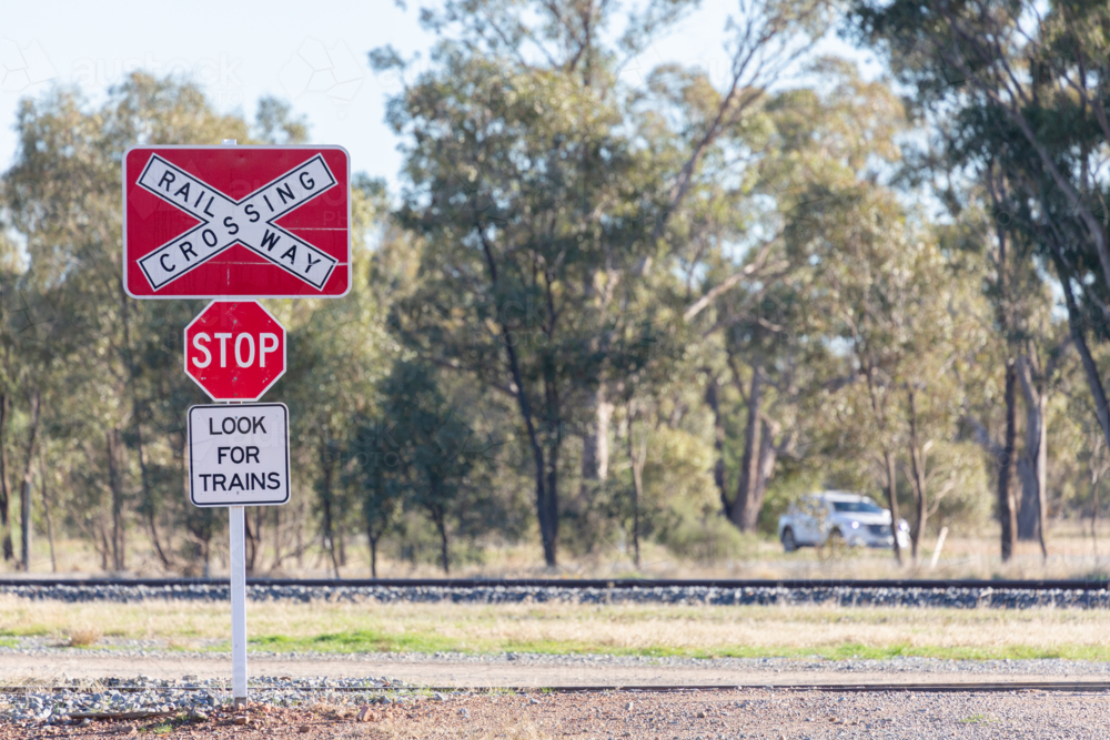 Railway crossing stop look for trains sign - Australian Stock Image