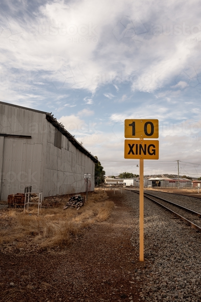 Railway sign next to railway shed and railway lines - Australian Stock Image