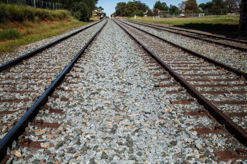 Image of Railway, train tracks and gravel leading into distance