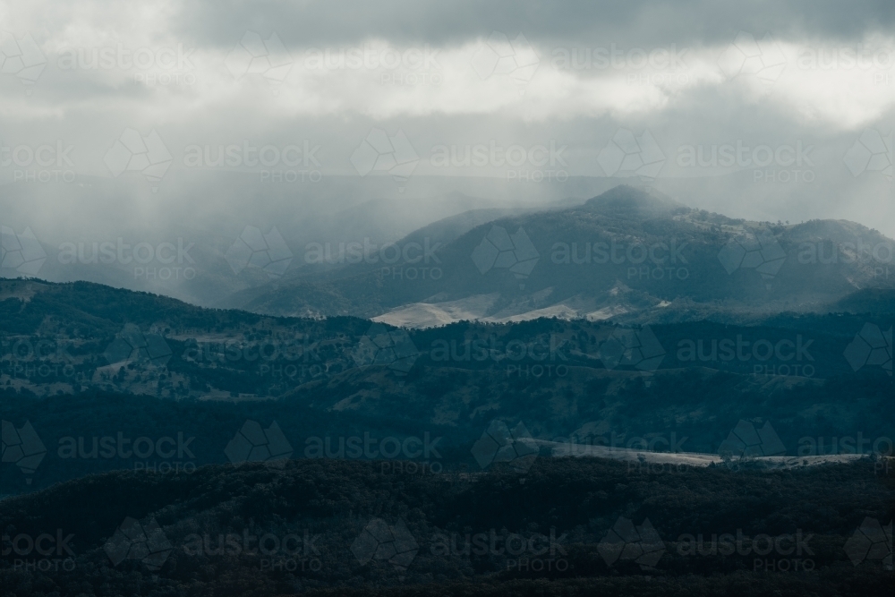 Rain clouds rolling into the Megalong Valley from Cahill's Lookout, Blue Mountains. - Australian Stock Image