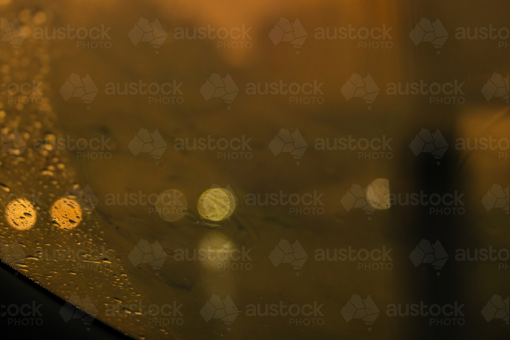 Image of Rain droplets on window with bokeh background, dark and moody ...