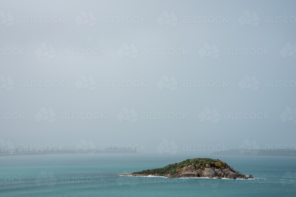 Rain over island - Australian Stock Image