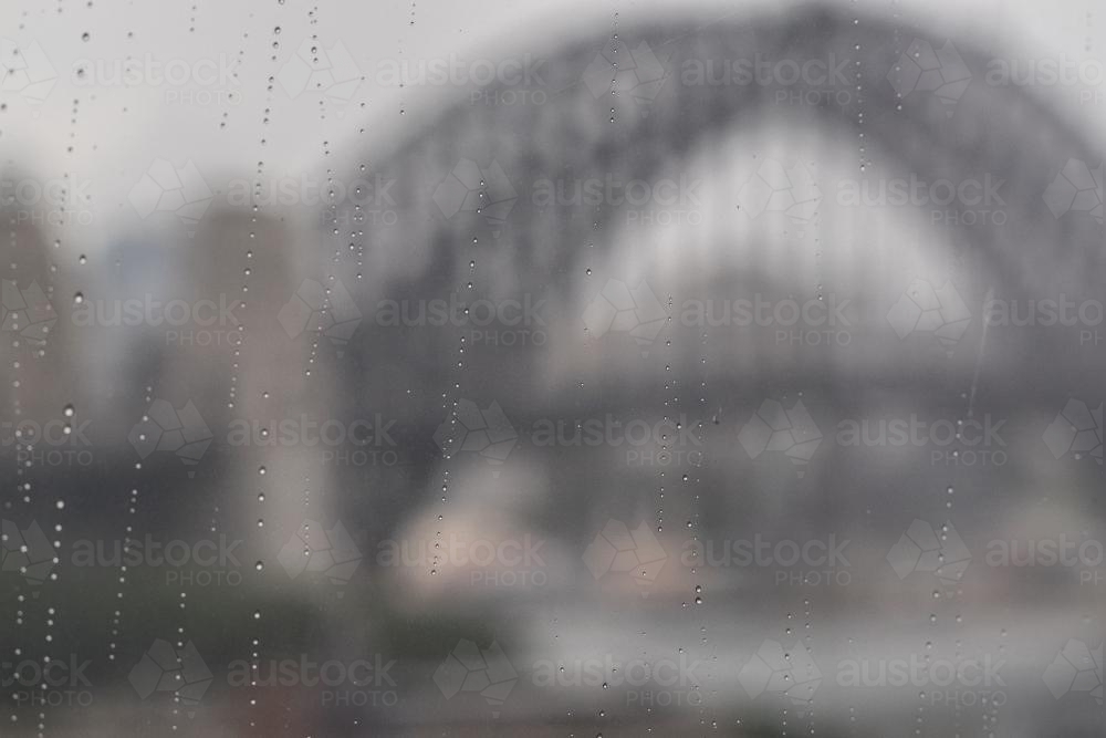 Rain running down window in Sydney - Australian Stock Image