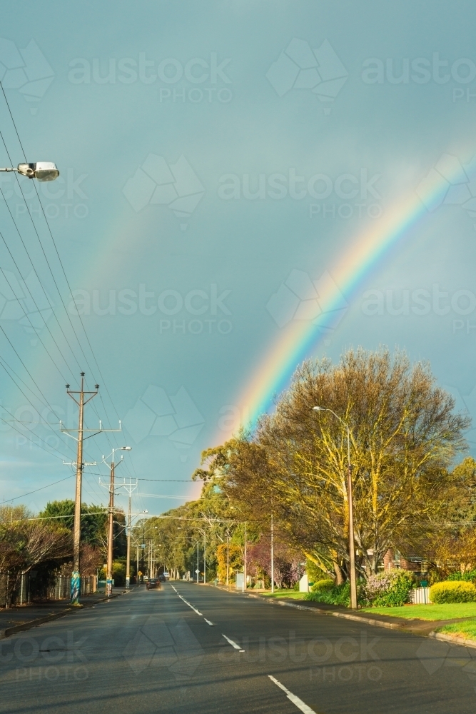 Rainbow at the end of the road in a suburban street - Australian Stock Image