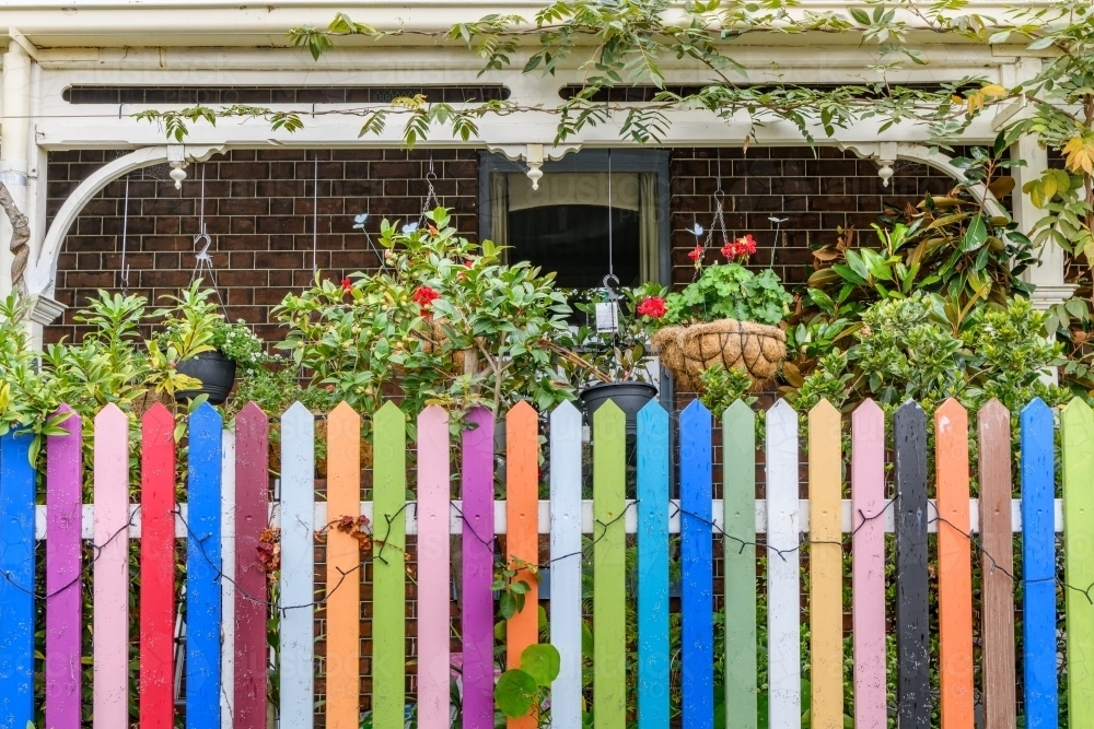 rainbow coloured fence and terrace - Australian Stock Image