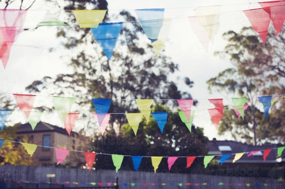 Rainbow flags at backyard party - Australian Stock Image