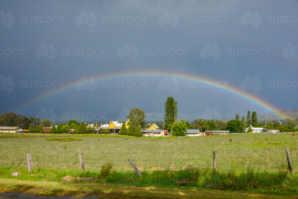 Rainbow over the old Railway Station in Tenterfield, New South Wales - Australian Stock Image