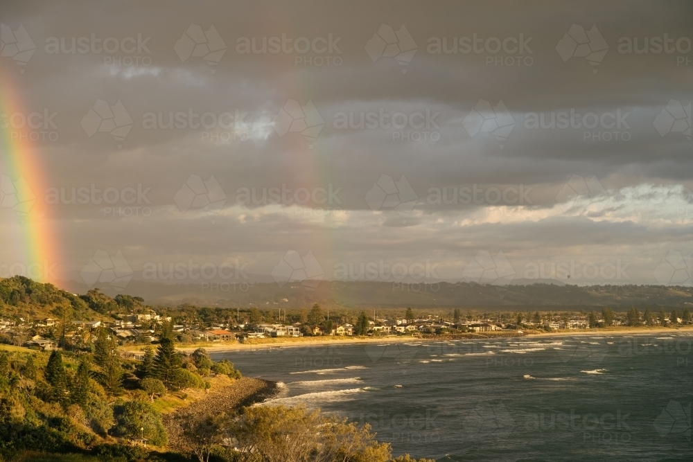 Rainbow over town - Australian Stock Image