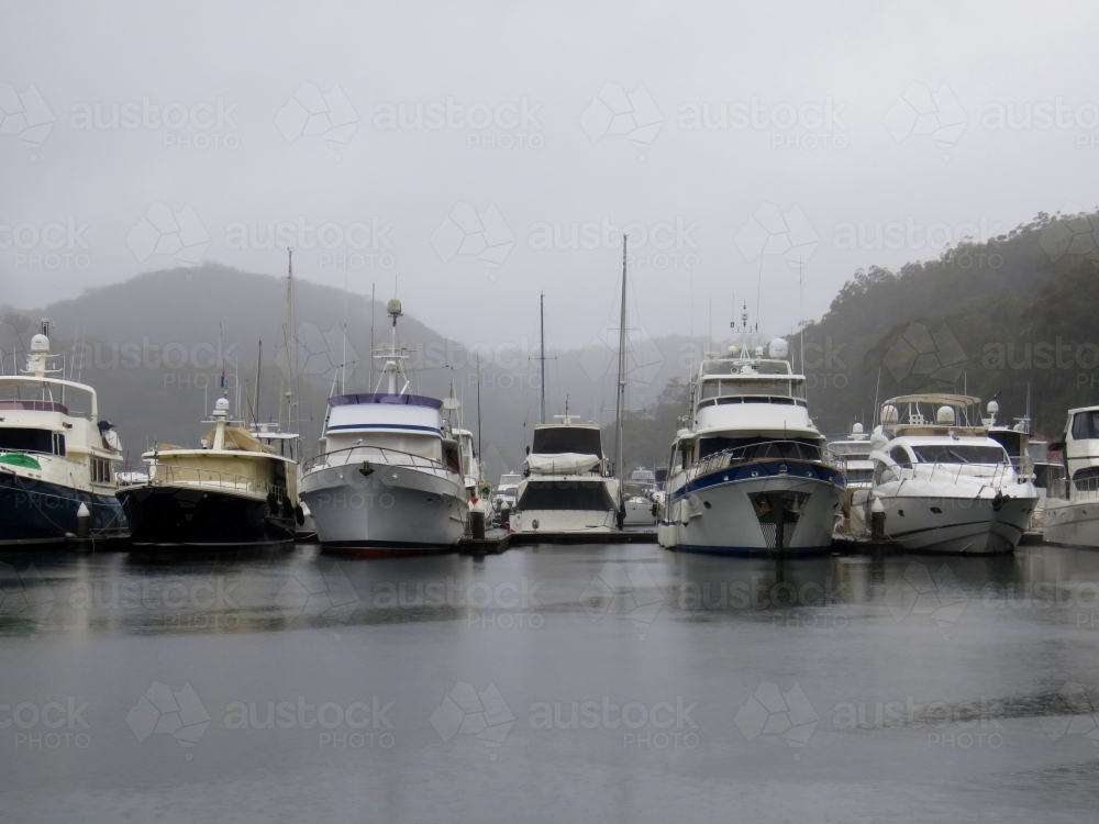 Rainy waterfront at a marina on grey dreary day - Australian Stock Image