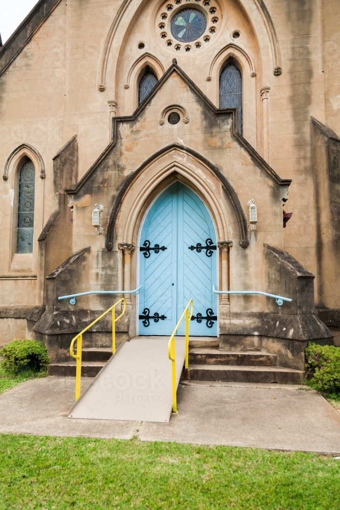 Ramp up to blue front doors of old church - Australian Stock Image