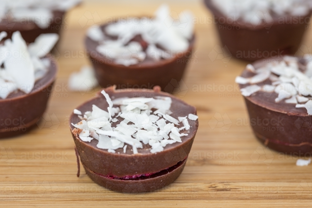 Raw chocolate desserts with coconut - Australian Stock Image