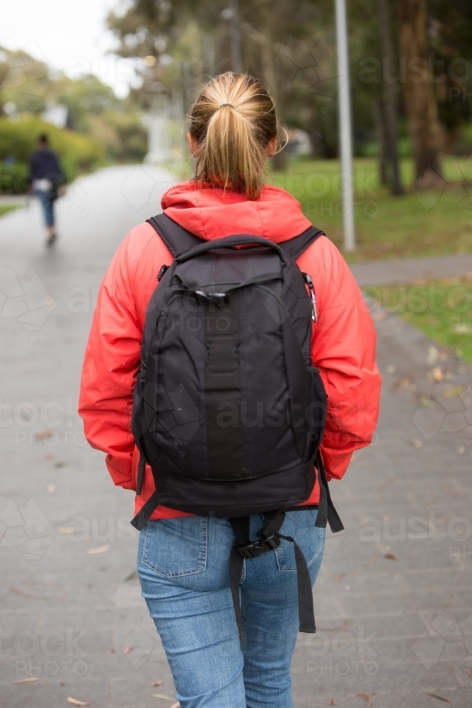 Rear View of a Student Walking on Campus - Australian Stock Image