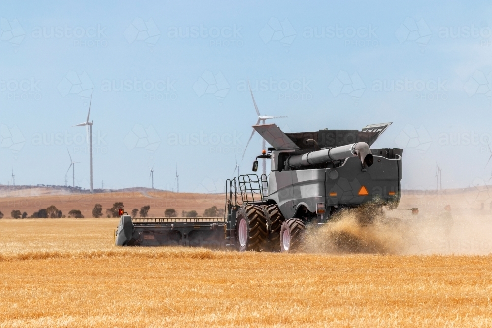 rear view of crop being harvested - Australian Stock Image