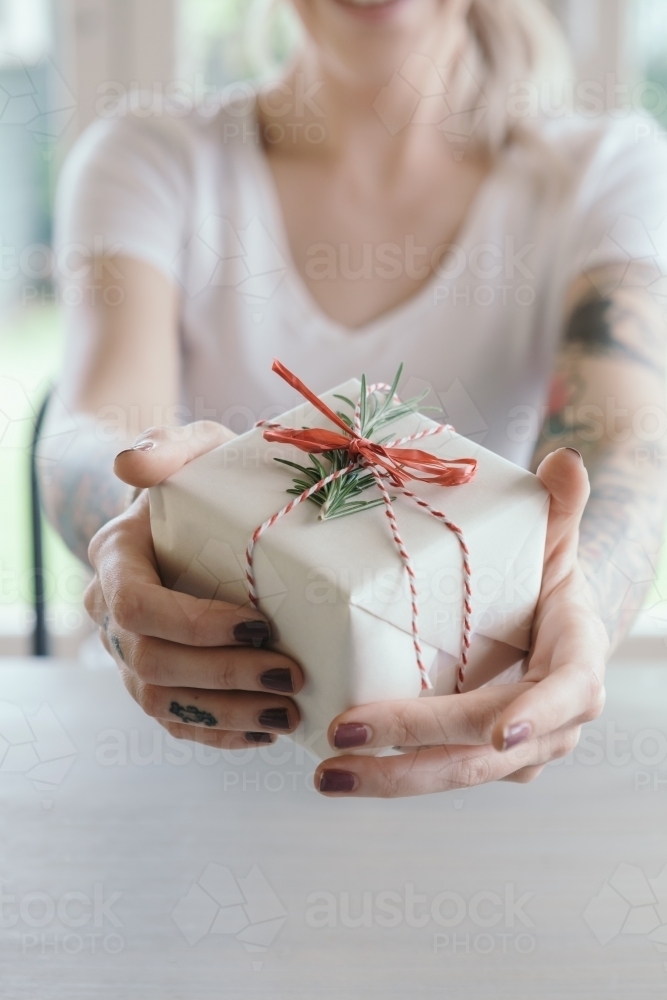 Receiving a christmas gift close up point of view - Australian Stock Image