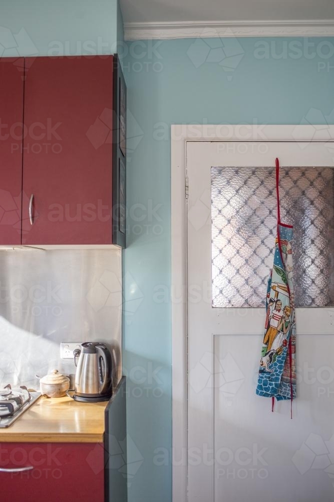 Red and teal kitchen interior - Australian Stock Image