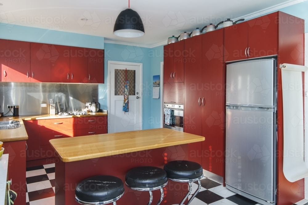 Red and teal retro kitchen interior - Australian Stock Image