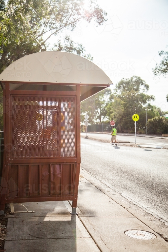 Red bus stop shelter on street in Singleton - Australian Stock Image