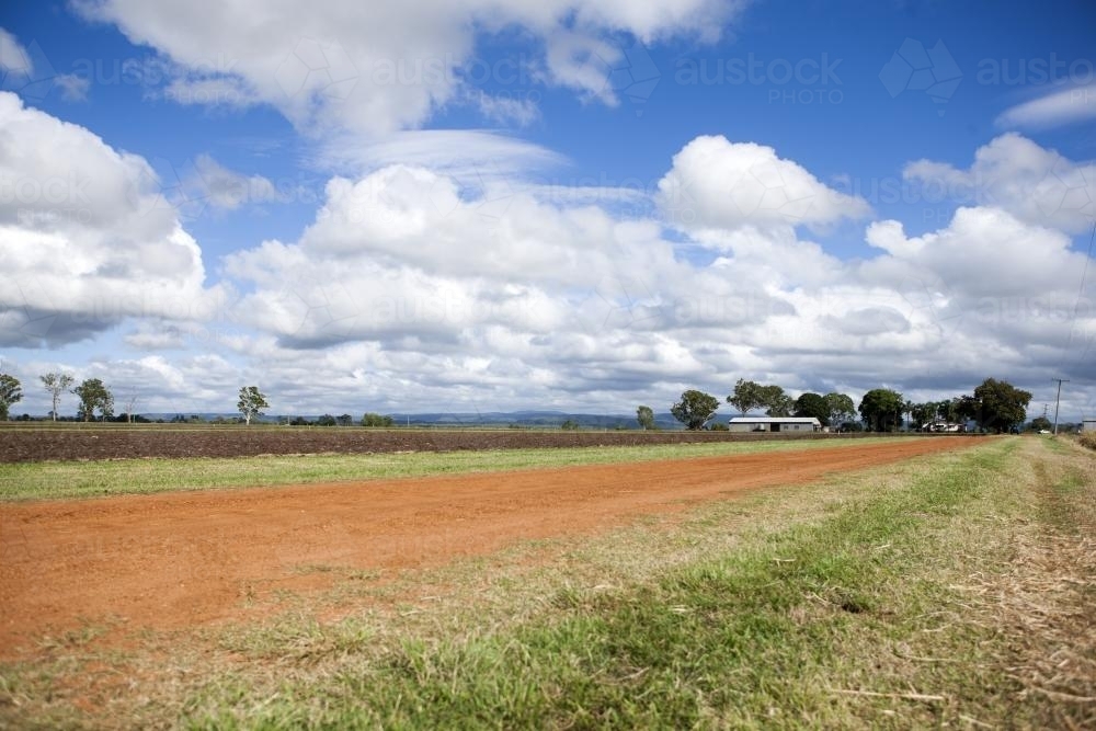 Red dirt track in rural Austraia - Australian Stock Image