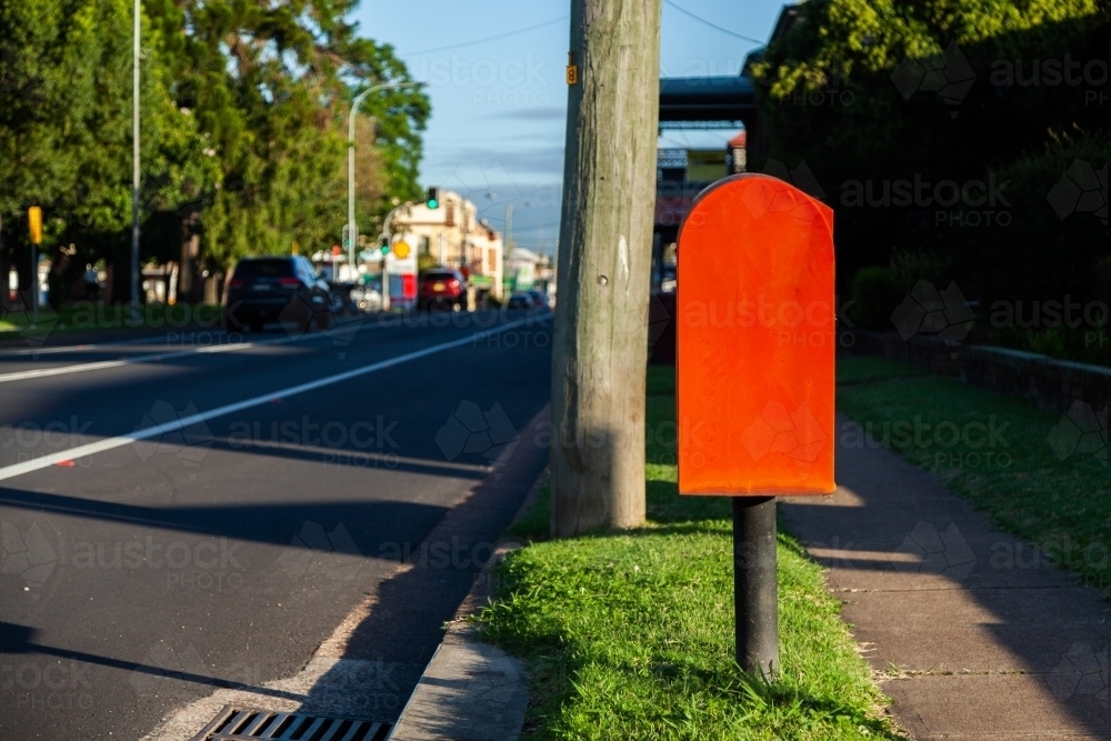 Red post box on Australian street - Australian Stock Image