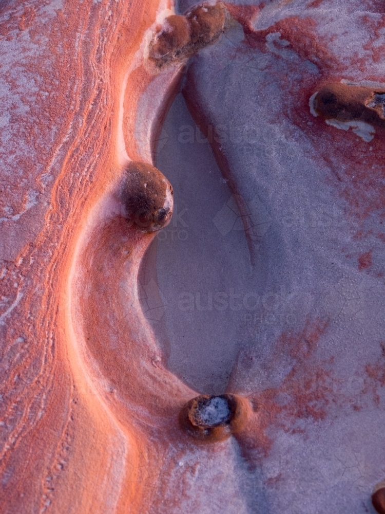 Red Rock Formation on a Beach - Australian Stock Image