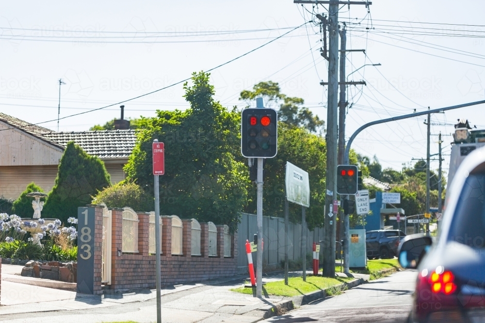 red stop light and no stopping sign at roadside - Australian Stock Image