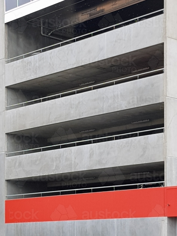 Red stripe on concrete facade - Australian Stock Image