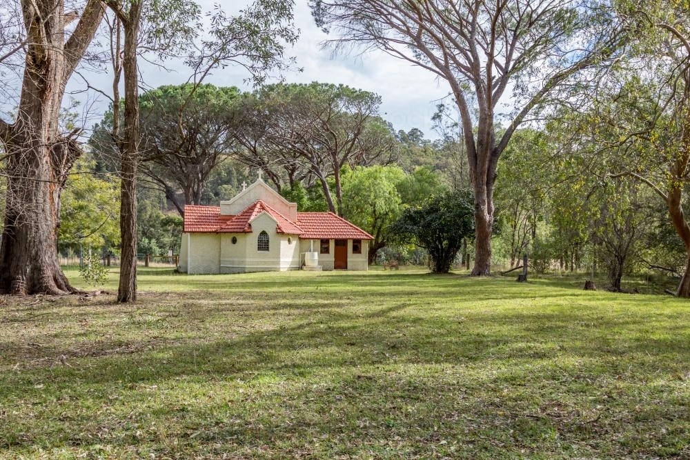 Reedy Creek country church among trees in the bush - Australian Stock Image