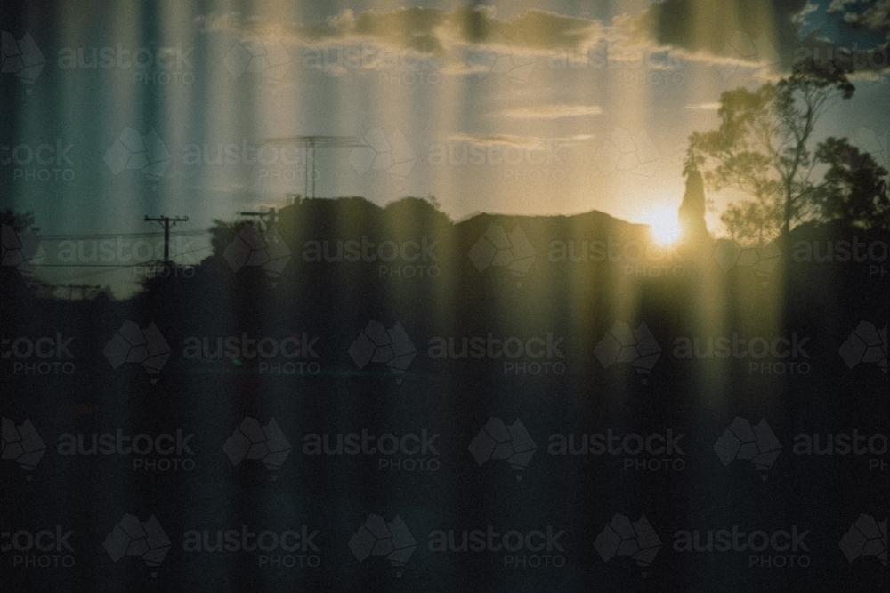 Reflection of backyard in a dark window - Australian Stock Image