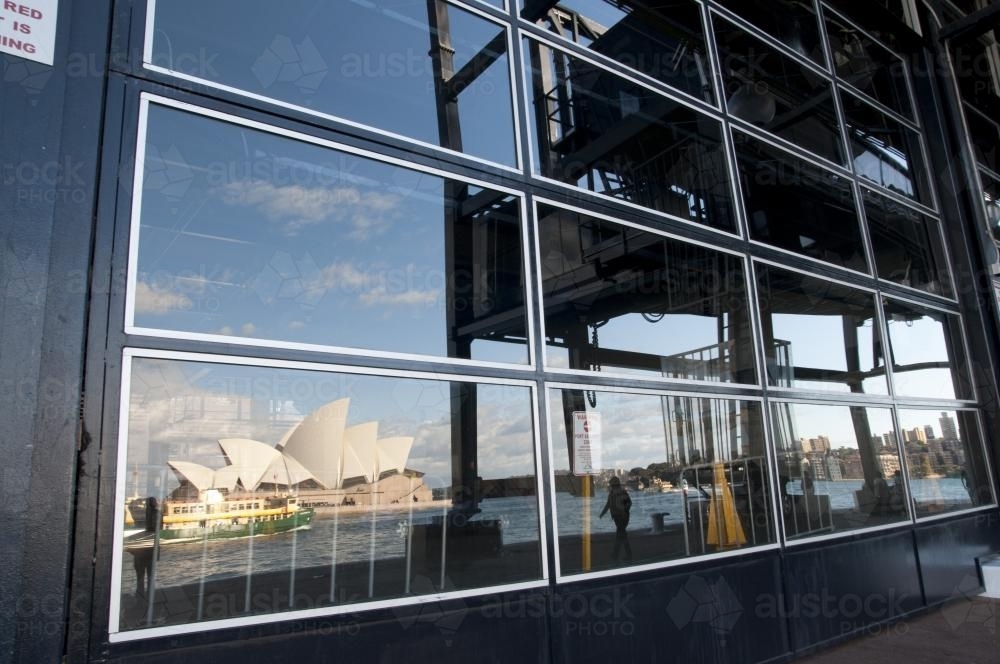 Reflection of Sydney Opera House in windows of a building - Australian Stock Image
