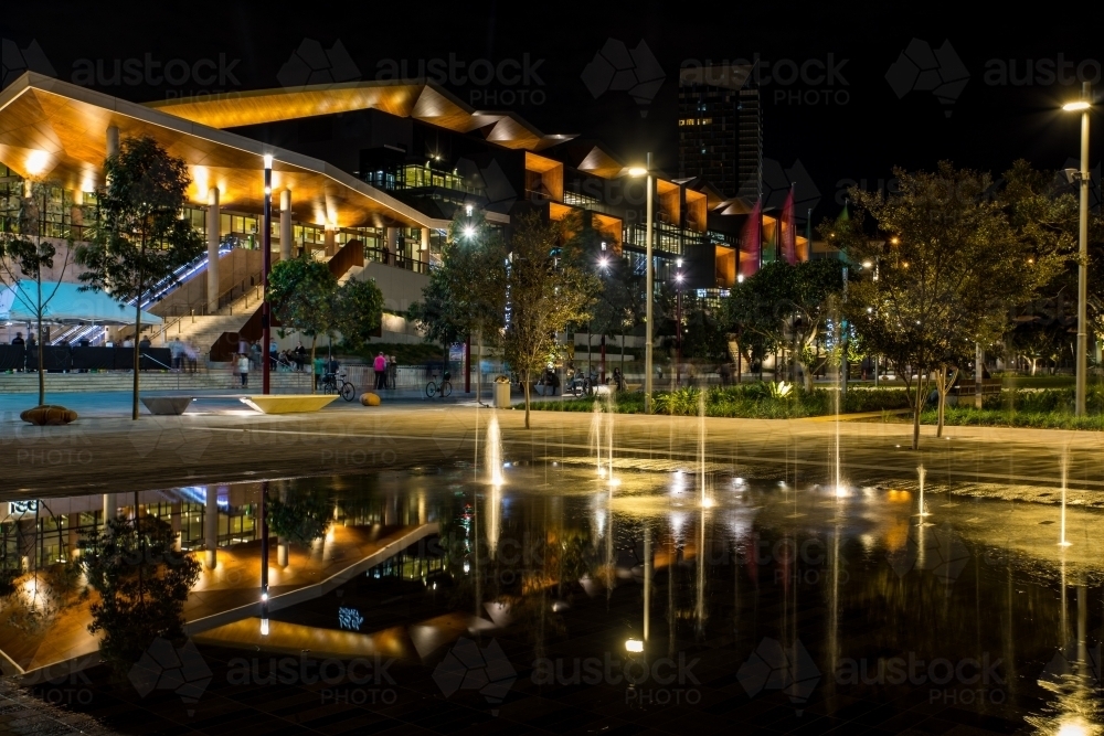 Reflection of the night lights in the forecourt fountain at Darling Harbour, Sydney - Australian Stock Image