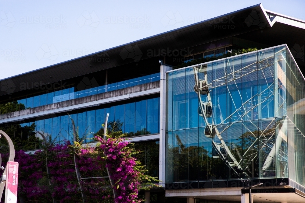 reflection of the wheel at south bank onto a nearby building - Australian Stock Image