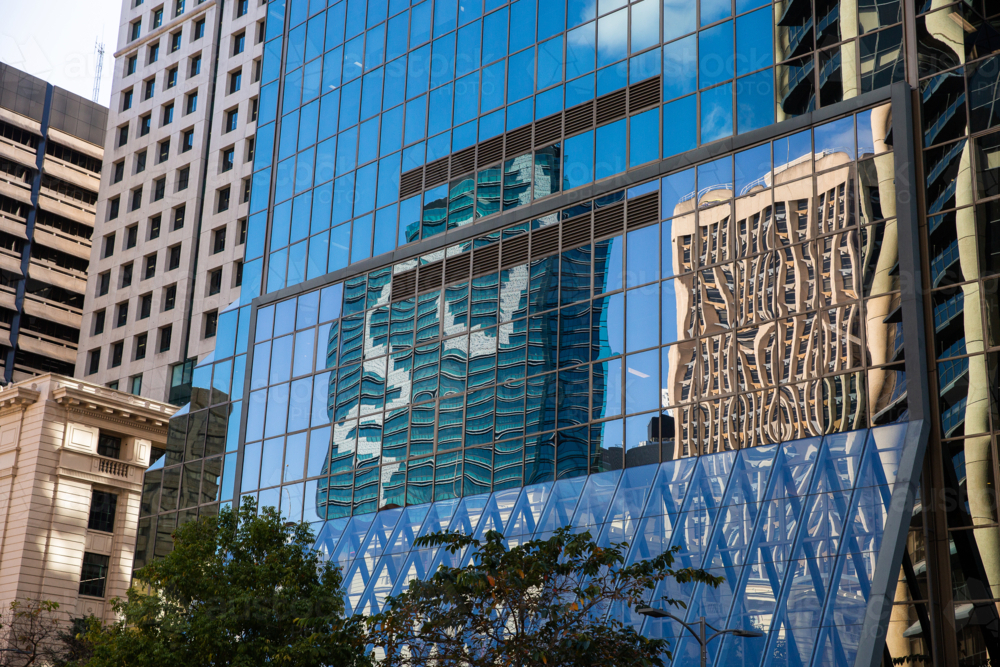 reflection on the glass wall of a building in Brisbane CBD - Australian Stock Image